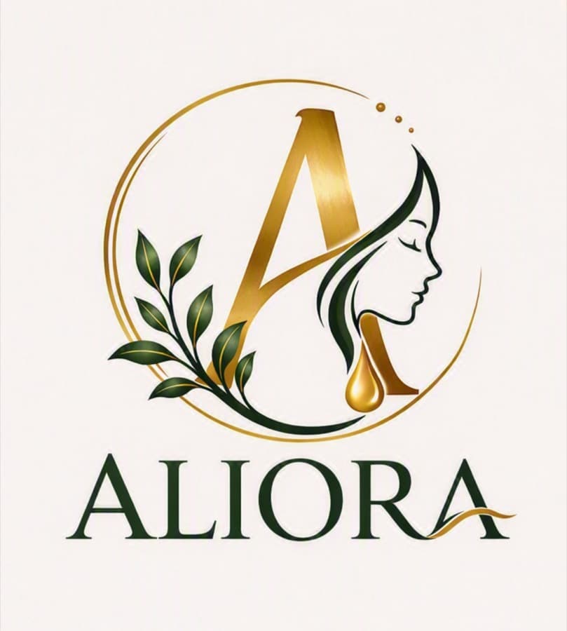 The Aliora mark: a gold A wrapped in a botanical sprig, with a falling drop of oil
